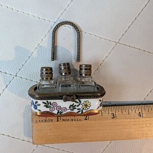 Perfume Bottles In A Decorative Ceramic Basket